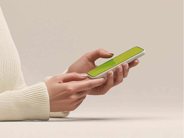 A hand holds a phone while starting a medical weight loss plan online