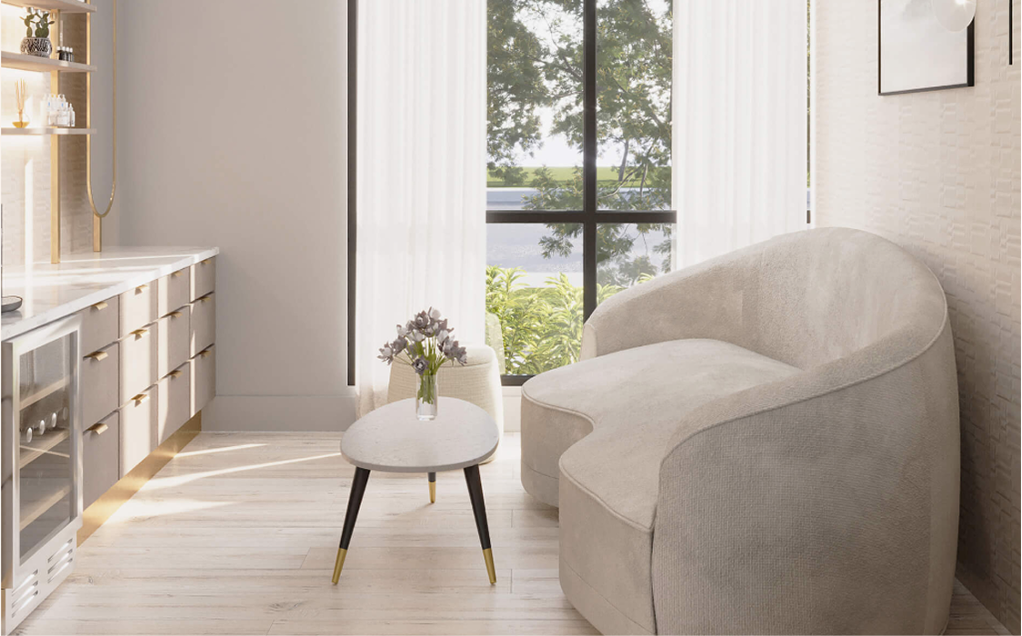A quiet waiting area with an armchair and window light at GENEVA Med in Alpharetta
